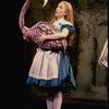 Actress Kate Burton w. flamingo in a scene fr. the Broadway revival of "Alice in Wonderland."