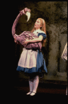 Actress Kate Burton w. flamingo in a scene fr. the Broadway revival of "Alice in Wonderland."