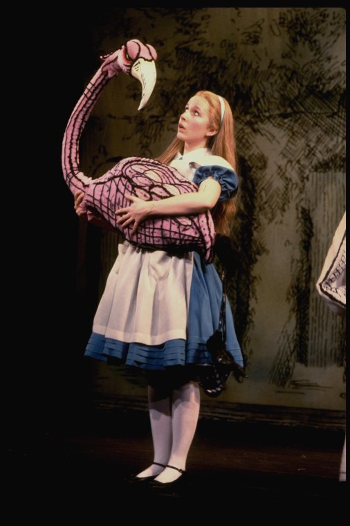 Kate Burton w. flamingo in a scene fr. the Broadway revival of "Alice in Wonderland." 1982
