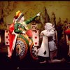 Actor Brian Reddy (2L) as the Queen of Hearts w. cast in a scene fr. the Broadway revival of "Alice in Wonderland."