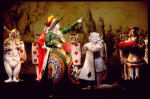 Actor Brian Reddy (2L) as the Queen of Hearts w. cast in a scene fr. the Broadway revival of "Alice in Wonderland."