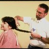 Actress Danielle Findley getting her hair cut in a publicity shot for the Broadway musical "Annie 2: Miss Hannigan's Revenge." (New York)