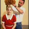 Actress Danielle Findley being fitted with red "Annie" wig in a publicity shot for the Broadway musical "Annie 2: Miss Hannigan's Revenge." (New York)