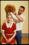 Actress Danielle Findley being fitted with red "Annie" wig in a publicity shot for the Broadway musical "Annie 2: Miss Hannigan's Revenge." (New York)