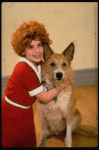 Actress Danielle Findley in costume as "Annie" w. dog Beau ("Sandy") in a publicity shot for the Broadway musical "Annie 2: Miss Hannigan's Revenge." (New York)