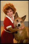 Actress Danielle Findley in costume as "Annie" w. dog Beau ("Sandy") in a publicity shot for the Broadway musical "Annie 2: Miss Hannigan's Revenge." (New York)