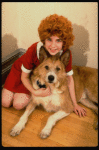 Actress Danielle Findley in costume as "Annie" w. dog Beau ("Sandy") in a publicity shot for the Broadway musical "Annie 2: Miss Hannigan's Revenge." (New York)