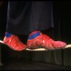 The feet of actor Avner Eisenberg walking a tightrope in a scene fr. the Off-Broadway one man show "Avner the Eccentric." (New York)