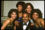 Singer Bobby Short (C) w. ensemble (incl. dancer Mercedes Ellington, L) in a publicity shot fr. the Broadway revue "Black Broadway." (New York)
