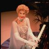 Entertainer the "Incomparable" Hildegarde at the piano in a scene fr. the concert "Big Broadcast of 1944." (Westbury)