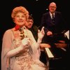 Entertainer the "Incomparable" Hildegarde (L) & announcer Don Wilson (R) in a scene fr. the concert "Big Broadcast of 1944." (Westbury)