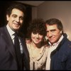 L-R) Singer Placido Domingo, actress Linda Ronstadt & producer Joseph Papp backstage at the New York Shakespeare Festival production of the musical "La Boheme." (New York)