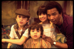 Actor Al Freeman, Jr. (R) w. children in a scene fr. the Broadway musical "Look to the Lilies." (New York)