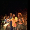 Actors Carmen Alvarez (3R), Tito Vandis (2R) & Patti Karr (R) w. cast in a scene fr. the Broadway musical "Look to the Lilies." (New York)