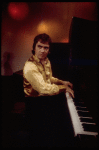 Actor Dudley Moore playing the piano in a scene fr. the Broadway comedy "Good Evening." (New York)