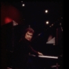 Actor Dudley Moore playing the piano in a scene fr. the Broadway comedy "Good Evening." (New York)