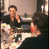 Actress Carole Shelley reflected in her dressing room mirror while applying makeup during the first National tour of the Broadway play "Broadway Bound." (Baltimore)