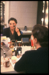 Actress Carole Shelley reflected in her dressing room mirror while applying makeup during the first National tour of the Broadway play "Broadway Bound." (Baltimore)