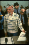 Director Hal Prince examining costume renderings at the first rehearsal of the Broadway musical "A Doll's Life." (New York)
