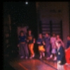 Actor Jim Walton (C) w. cast in a scene fr. the Broadway musical "Merrily We Roll Along." (New York)