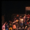 Actor Jim Walton (C) w. cast in a scene fr. the Broadway musical "Merrily We Roll Along." (New York)