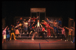 Actor Jim Walton (C) w. cast in a scene fr. the Broadway musical "Merrily We Roll Along." (New York)