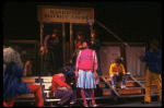 Actress Tonya Pinkins (C) w. cast in a scene fr. the Broadway musical "Merrily We Roll Along." (New York)