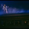 Actor Peter Allen atop train in a scene fr. the Broadway musical "Legs Diamond." (New York)