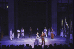 Actors Kathryn Meisle & Raul Julia (C) w. cast in a scene fr. the New York Shakespeare Festival production of the play "Othello" at the Delacorte Theater in Central Park. (New York)