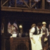 Actor Brian Murray (seated) with cast members in a scene from the New York Shakespeare Festival production of the play "The Merry Wives of Windsor" at the Delacorte Theatre in Central Park (New York)