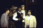 Actor Reggie Montgomery (C) with cast members in a scene from the New York Shakespeare Festival production of the play "The Merry Wives of Windsor" at the Delacorte Theatre in Central Park (New York)