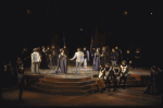 Actors (C) Mary Elizabeth Mastrantonio & Kevin Kline w. cast members in a scene fr. the New York Shakespeare Festival production of the play "Henry V" at the Delacorte Theatre in Central Park. (New York)