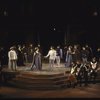 Actors (C) Mary Elizabeth Mastrantonio & Kevin Kline w. cast members in a scene fr. the New York Shakespeare Festival production of the play "Henry V" at the Delacorte Theatre in Central Park. (New York)