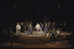 Actors (C) Mary Elizabeth Mastrantonio & Kevin Kline w. cast members in a scene fr. the New York Shakespeare Festival production of the play "Henry V" at the Delacorte Theatre in Central Park. (New York)