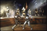 Actor (C, L) Kevin Kline duelling w. cast members in a scene fr. the New York Shakespeare Festival production of the play "Henry V" at the Delacorte Theatre in Central Park. (New York)