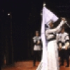 Actors (C) Denzel Washington and Sharon Washington with cast members in a scene from the New York Shakespeare Festival production of the play "Richard III" at the Delacorte Theatre in Central Park (New York)