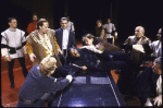 Actor Denzel Washington (C, on table) with cast members in a scene from the New York Shakespeare Festival production of the play "Richard III" at the Delacorte Theatre in Central Park (New York)