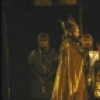 Actor Kevin Conway (seated) with cast members in a scene from the New York Shakespeare Festival production of the play "King John" at the Delacorte Theatre in Central Park (New York)