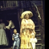 Actress Myra Merritt (C) w. cast members in a scene fr. the Houston Grand Opera production on Broadway of the opera "Porgy And Bess." (New York)