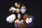 Actress Robbie McCauley with masked figures in a scene from the Interart Theatre's production of the performance piece "Solo Voyages" (New York)