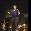 Actor Anthony Quinn (C) with actor-turned-director Rob Marshall (L) and actor Frank DeSal (R) in a scene from the Broadway revival of the musical "Zorba." (New York)