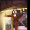 Dancer dressed in oversized Liza Minnelli costume with enormous head in a scene from the musical revue "Hooray for Hollywood." (New York)