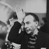 New York City Ballet choreographer George Balanchine talking to dancers in the wings, demonstrates salute for "Stars and Stripes" (New York)