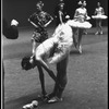 New York City Ballet production of "Symphony in C"; Patricia Neary tying toe shoes before performance, choreography by George Balanchine (New York)