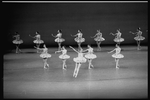 New York City Ballet production of "Divertimento No. 15" with Lourdes Lopez at center in air, choreography by George Balanchine (New York)