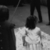 The Kennedy children visit backstage after a New York City Ballet performance of "Nutcracker", young John plays with his cousin in the fake snow.