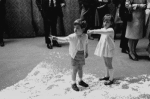 The Kennedy children visit backstage after a New York City Ballet performance of "Nutcracker", young John plays with his cousin in the fake snow.