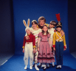 Studio photo of Peter Martins and students from the School of American Ballet in costume for a New York City Ballet production of "The Nutcracker" (New York)