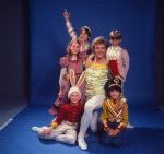 Studio photo of Peter Martins and students from the School of American Ballet in costume for a New York City Ballet production of "The Nutcracker" (New York)