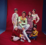 Studio photo of Peter Martins and students from the School of American Ballet in costume for a New York City Ballet production of "The Nutcracker" (New York)